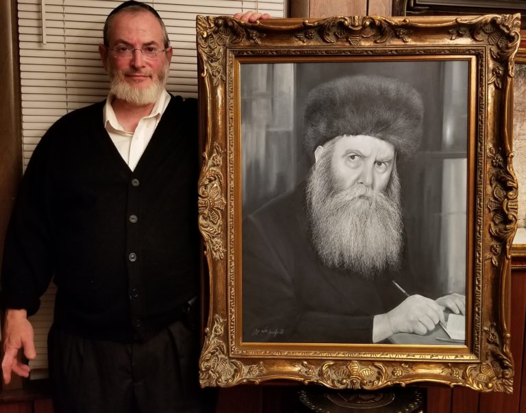 Shlomo proudly displaying the framed masterpiece.